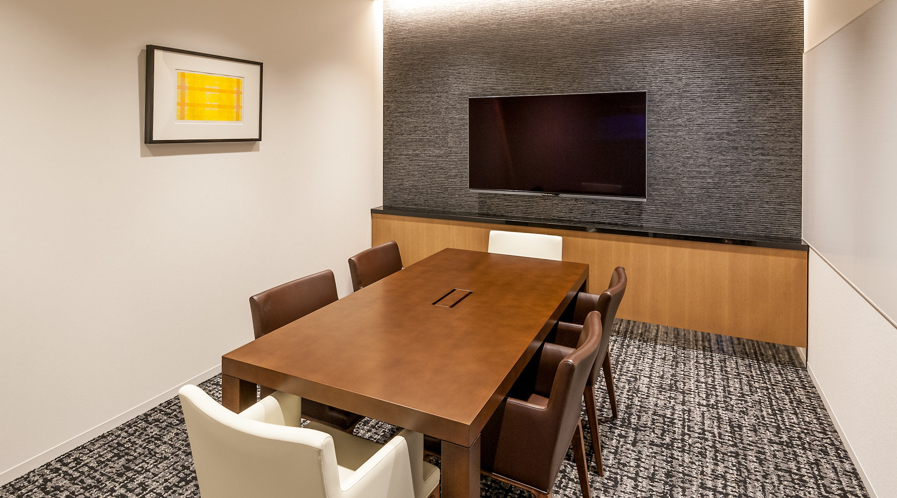 Meeting rooms are equipped with monitors and other equipment as well as whiteboards.