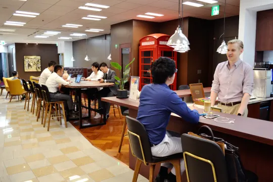 Co-working space with seating for all types of businesses and a telephone booth modeled after a London fixed-line phone.